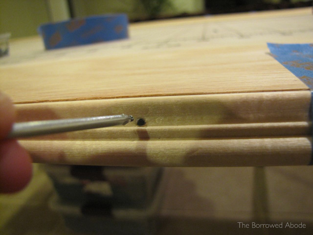 Countersink Trim Nails with another Nail | TheBorrowedAbode.com